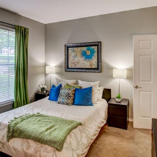 a bedroom with a large window