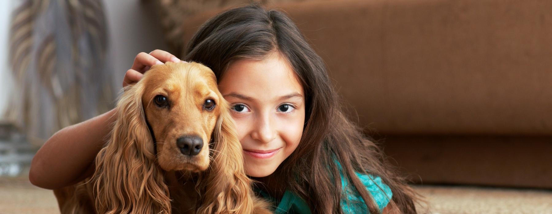 a person lying on the floor with a dog