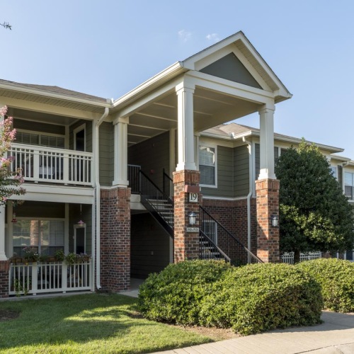 a building with trees and bushes