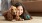 a person lying on the floor with a dog