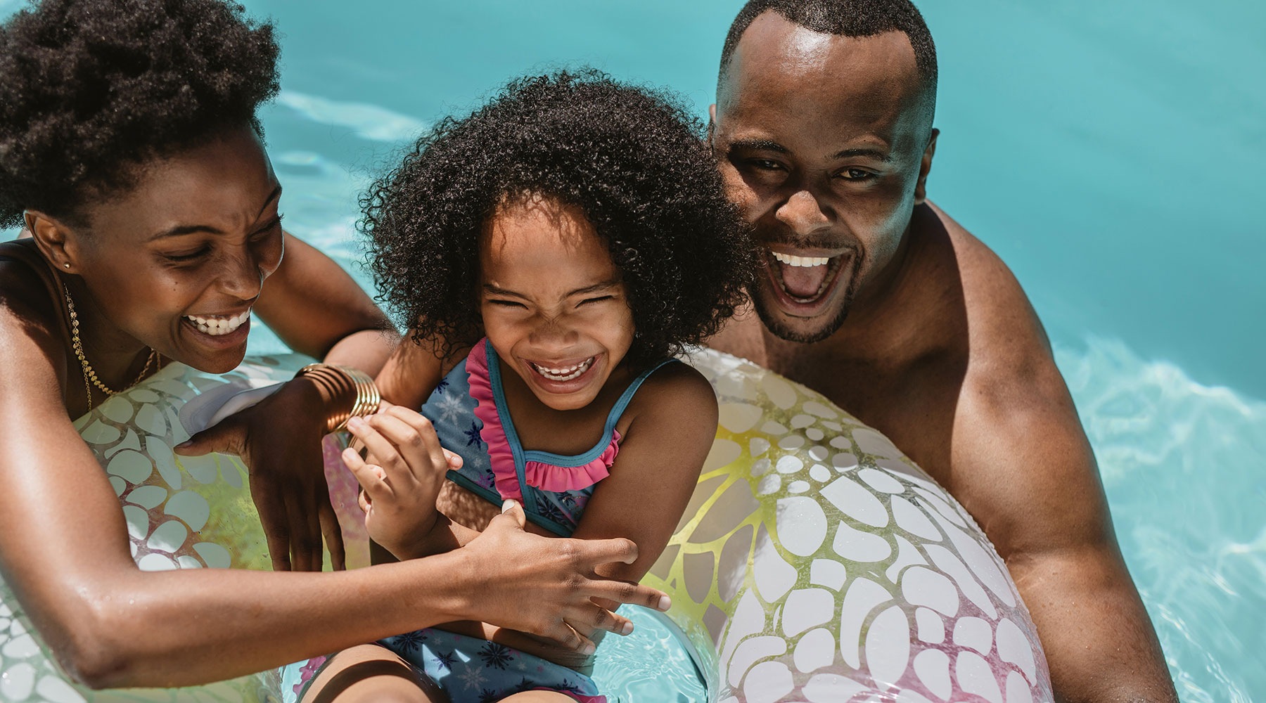 young family enjoying the pool