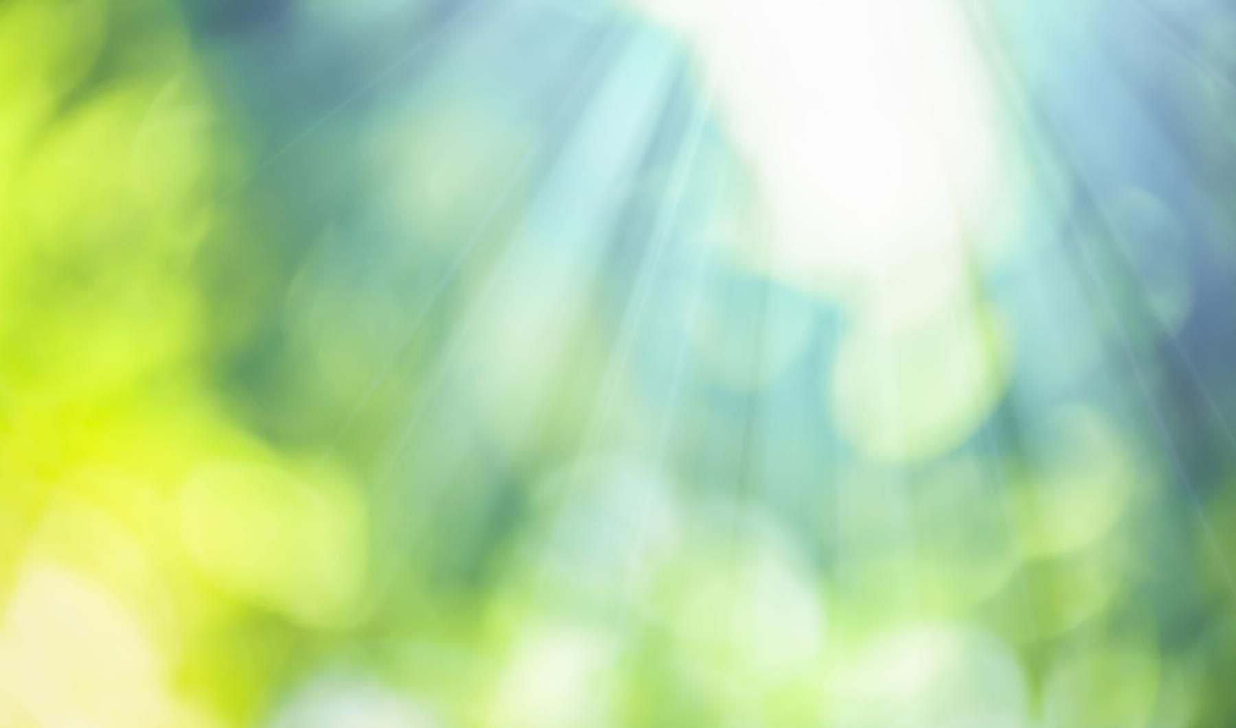 a blurry image of blue and green
